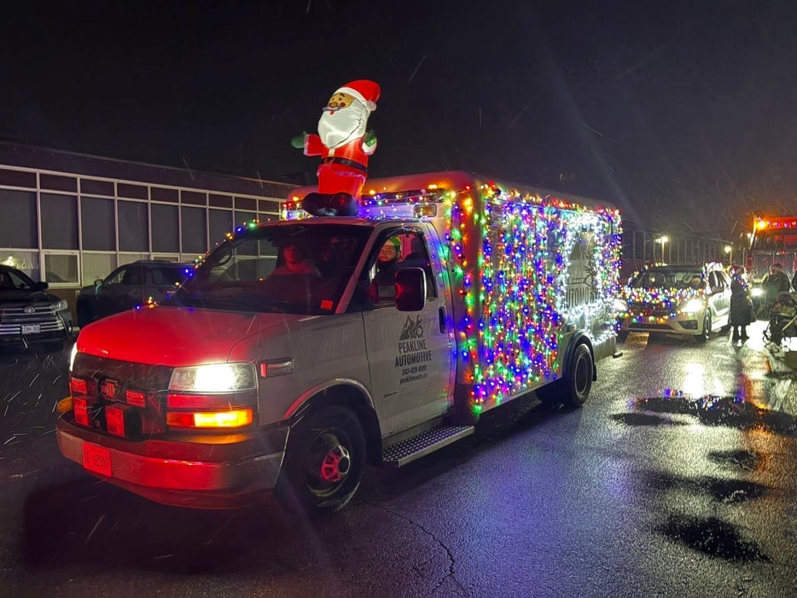 The Peakline service truck covered in lights in the local Santa Claus parade