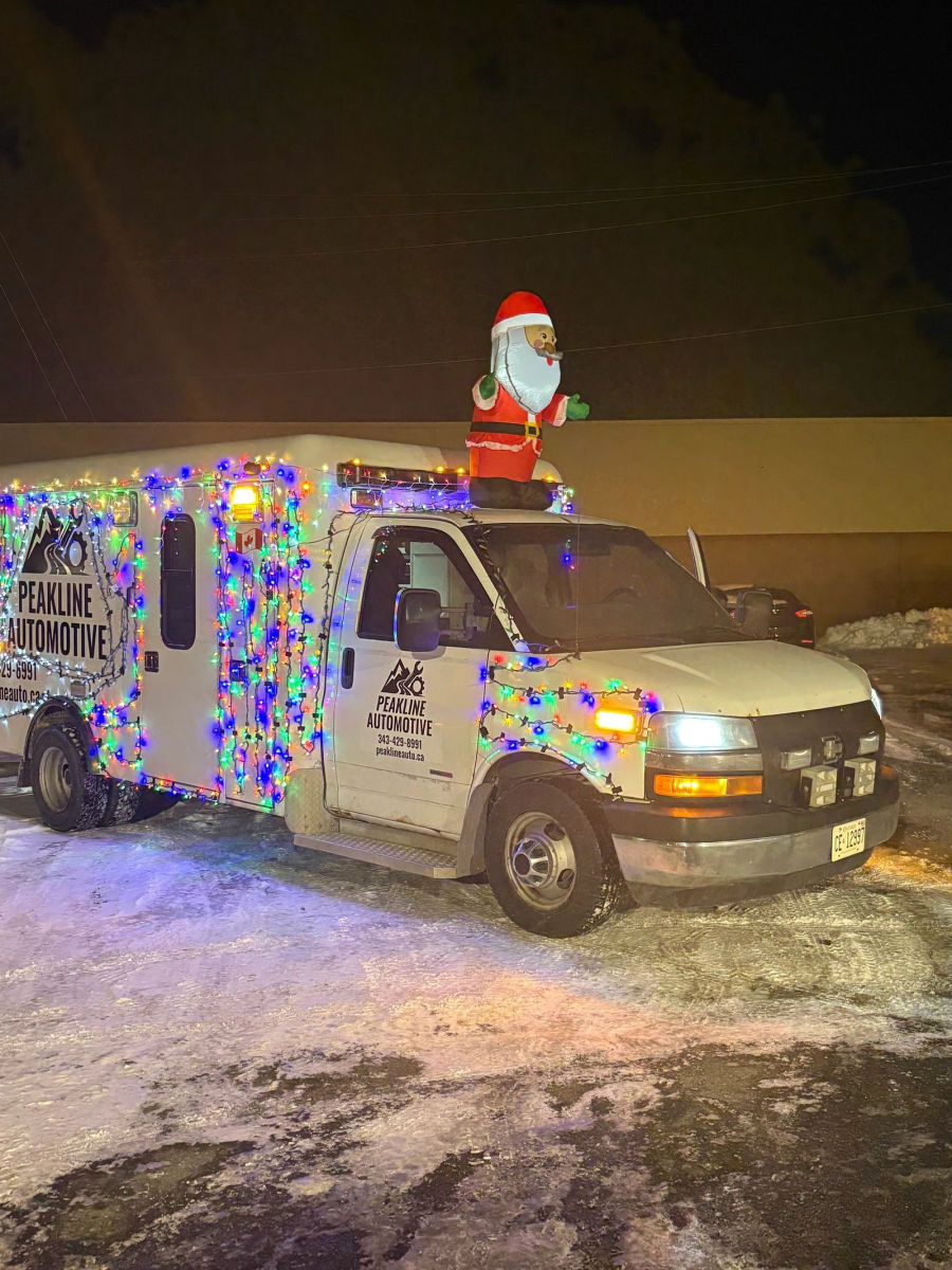 The Peakline service truck, a converted ambulance, lit up with Christmas lights